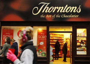 Customers shop inside Thorntons chocolate shop on Oxford Street in ...