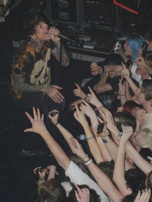 Oli Sykes prompts the crowd at his band's gig to record one particular ...