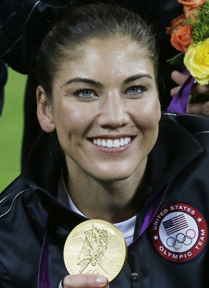 United States goalkeeper Hope Solo shows her gold medal after a gold ...