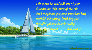 Yacht-near-the-tropic-island-with-bob-marley-quote