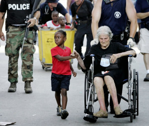 She is seen here holding the hand of fellow Hurricane Katrina victim ...