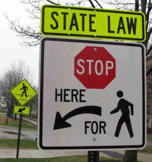 ... sign in Evanston reminds drivers to stop when pedestrians are present