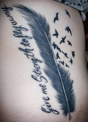 feather tattoo on calf