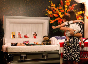 Funny photos war dead soldier casket wife baby