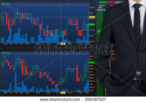 Businessman and fluctuation of the stock market - stock photo