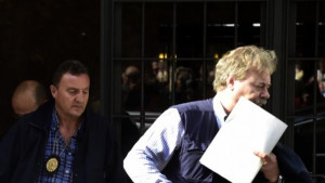 exit the apartment complex housing the Madrid home of Rodrigo Rato ...