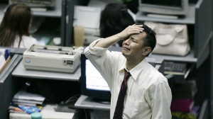 An Indonesian stockbroker reacts as the 2008 financial crisis triggers ...