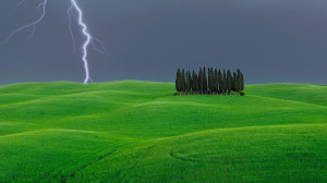 Lightning strike near a grove of cypress trees, Val d’Orcia, Italy ...