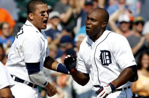 Tigers right fielder Torii Hunter is greeted at home plate by Victor ...