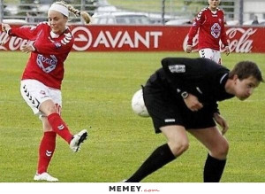 Girl Kicking A Ball At The Referee
