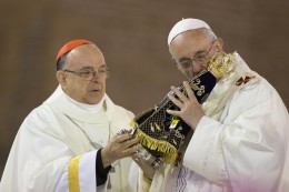 Pope Francis kissing an image of the Virgin of Aparecida, a black Mary ...