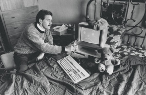 McAfee pictured in 1989, holding a stethoscope to a 'poorly' computer