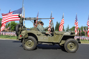 Vintage World War II Jeep drivers honor soldiers