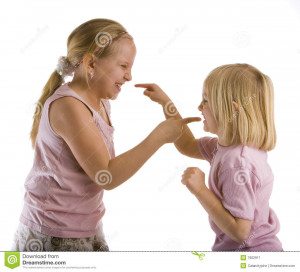 Sisters arguing with pointed fingers wearing pink.