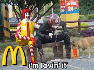 Vomiting guy sitting on McDonald Ronald statue bench
