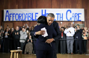 President Barack Obama hugs Edna Pemberton, who introduced him, before ...