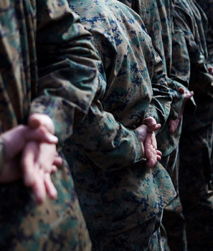 Marines stand at attention before a service held in honor of ...
