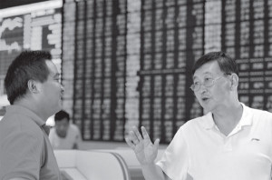 investors discuss market movements at a securities brokerage in fuyang ...