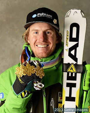 Ted Ligety celebrates with his three gold medals for winning the