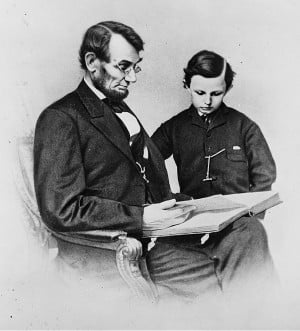 Abraham Lincoln reads with his youngest son, Tad Lincoln, in this 1864 ...