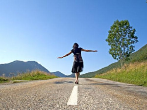 Woman walking down road