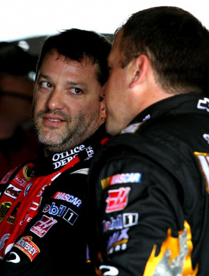 Tony Stewart confers with teammate Ryan Newman - NASCAR photo