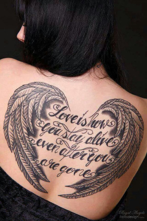 19 Woman back angel wings tattoo