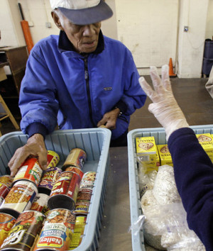 ... food next to another client, Mark Hatfield, at a food bank operated by