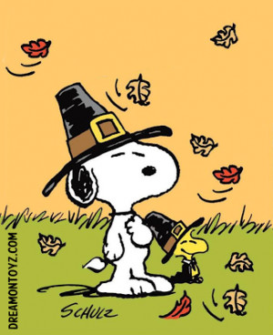 Pilgrims Snoopy and Woodstock in the grass with fall leaves