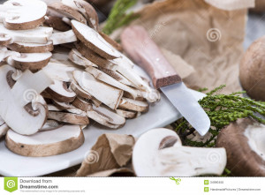 Fresh sliced Mushrooms on vintage background.