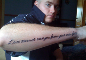 Quote Tattoo On Man Right Arm