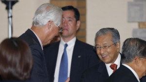 Singapore Emeritus Senior Minister Goh Chok Tong, left, talks with ...