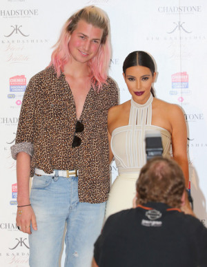 Wilkins Kim Kardashian poses for a photograph with Richard Wilkins