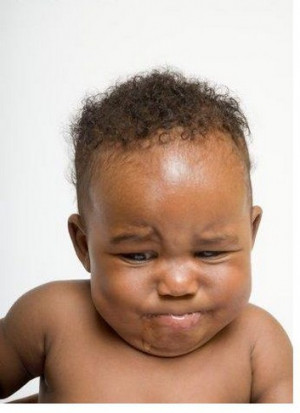 black baby boy with sad funny face.jpg