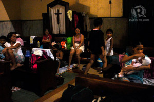 HOPING, WAITING. Evacuees stay inside the Sto Domingo Church until ...