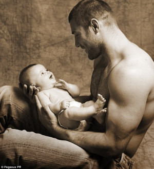 Ben Cohen cradling one of his twin daughters, Isabelle, when she was ...