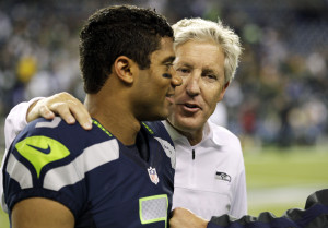 Seattle Seahawks head coach Pete Carroll, right, walks with ...