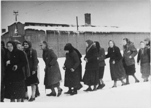 Female survivors trudge through the snow immediately after the ...