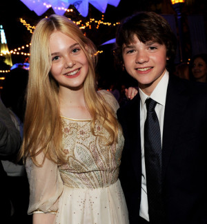 Joel Courtney Actors Elle Fanning (L) and Joel Courtney pose at the ...