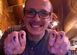 fingers, gage, glasses, piercing, quotation marks, quotes, tattoo