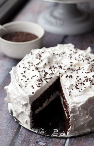 Deep dark chocolate devil’s food cake is topped with a fluffy ...