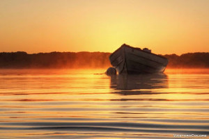 ... Pond: standing in the water to hide the rising sun behind the boat
