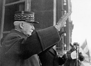 Marshal Pétain greets his supporters with a Nazi salute.