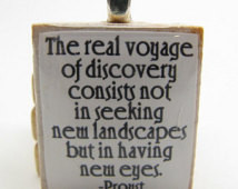 ... real voyage of discovery - whit e Scrabble tile with Proust quote