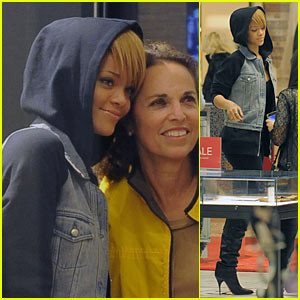 Rihanna takes pictures with fans while shopping at Saks Fifth Avenue ...
