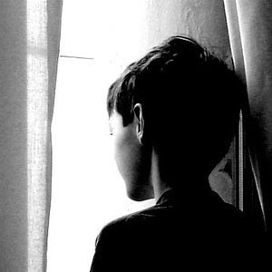 boy looking out the window as if without care a man he was trying to ...
