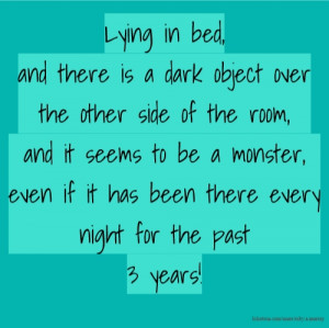 Lying in bed, and there is a dark object over the other side of the ...