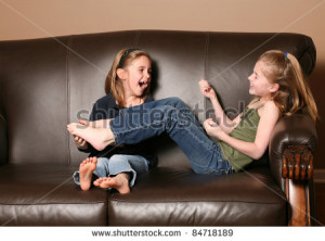Cute Little Girl Tickling Brother'S Feet Stock Photo 84965221 ...