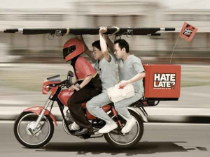 Pizza Delivery Man On Bike The pizza hut delivery guy