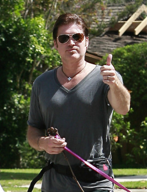 Billy Ray Cyrus sporting different Ray-Ban eye wear.